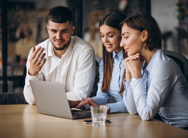 Group of people working out business plan in an office
